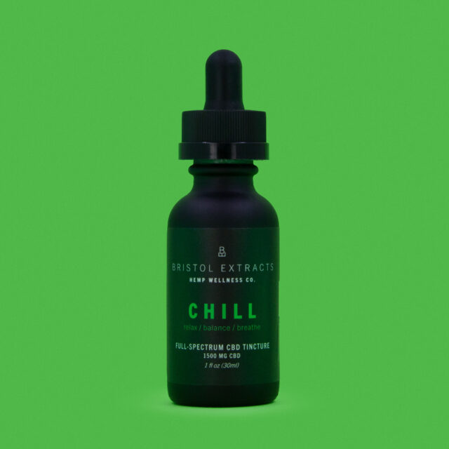 chill tincture bottle on green background