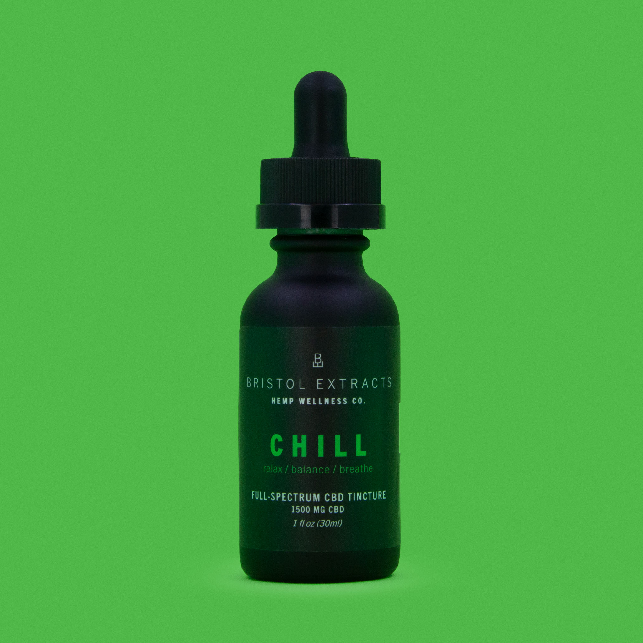 chill tincture bottle on green background