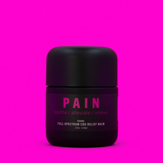 pain balm tub on pink background