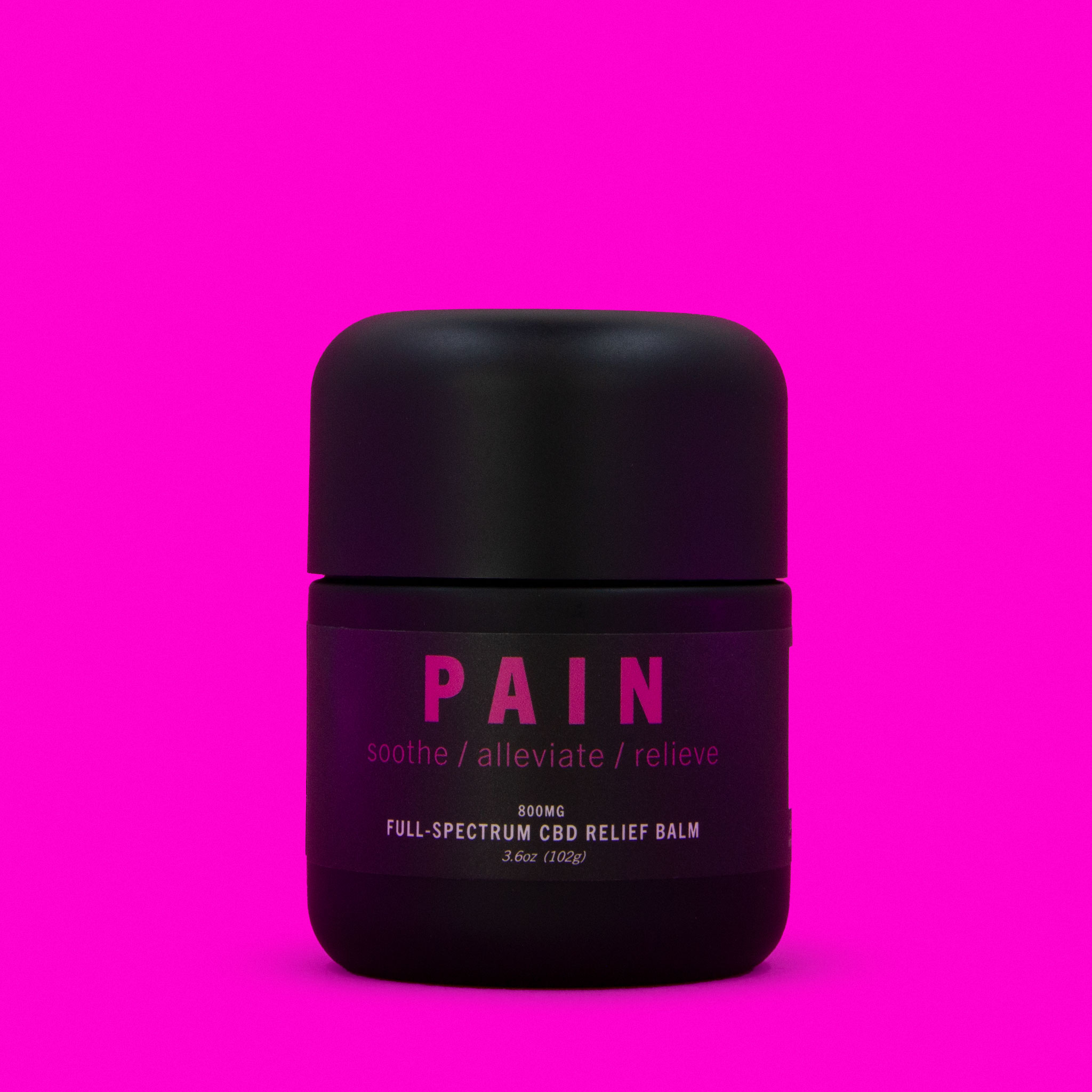 pain balm tub on pink background