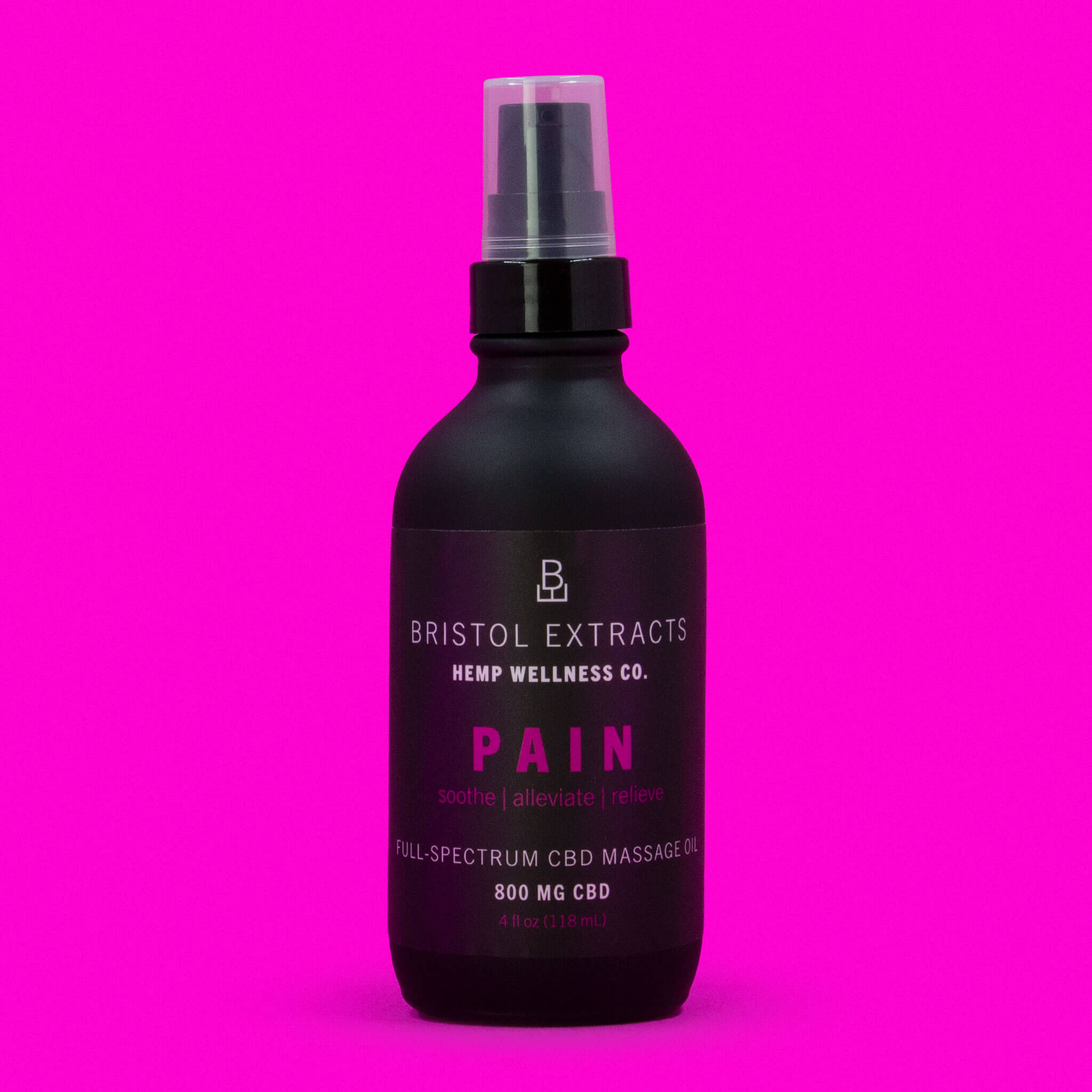 pain massage oil bottle on pink background