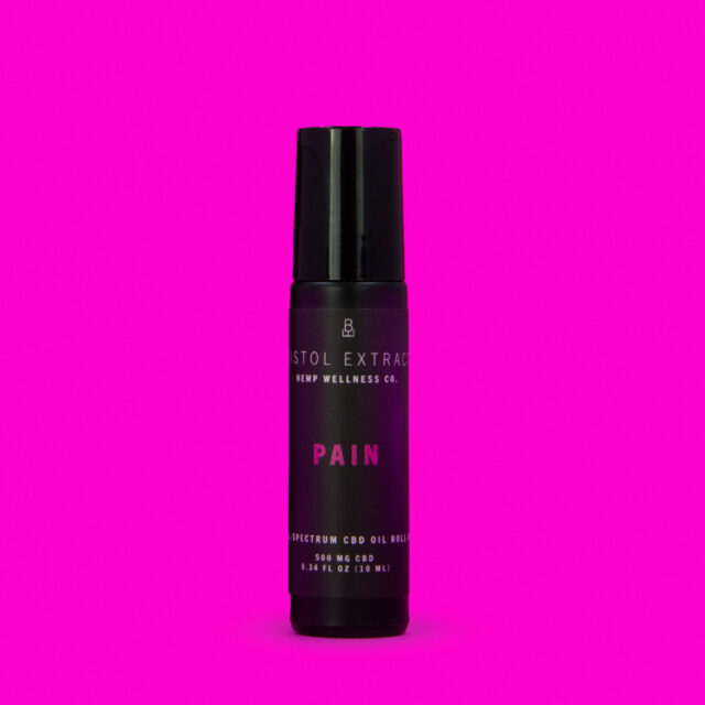 pain roll-on applicator on pink background