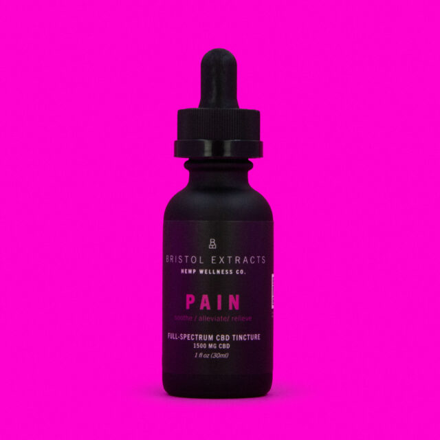 pain tincture bottle on pink back ground
