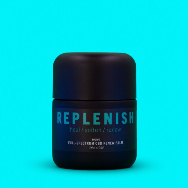 replenish balm tub on blue background